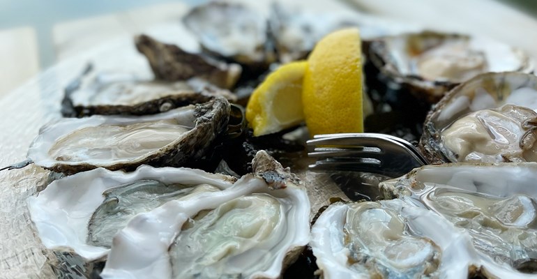 Eating oysters with lemon