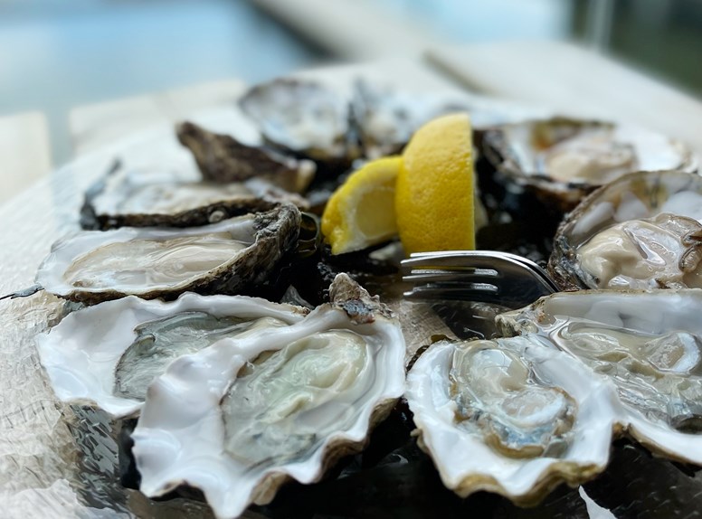 Eating oysters with lemon