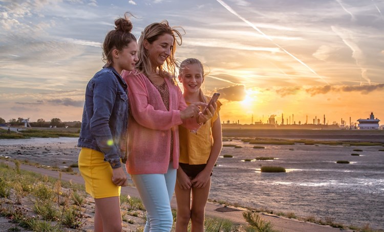 Family out and about at sunset in Terneuzen